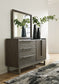 Arkenton California King Panel Bed with Mirrored Dresser, Chest and Nightstand