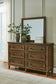 Sturlayne California King Upholstered Panel Bed, Dresser, Mirror, Chest and Nightstand